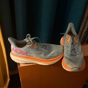 Hoka Lightweight Running Shoes in blue with Orange and Pink Accents